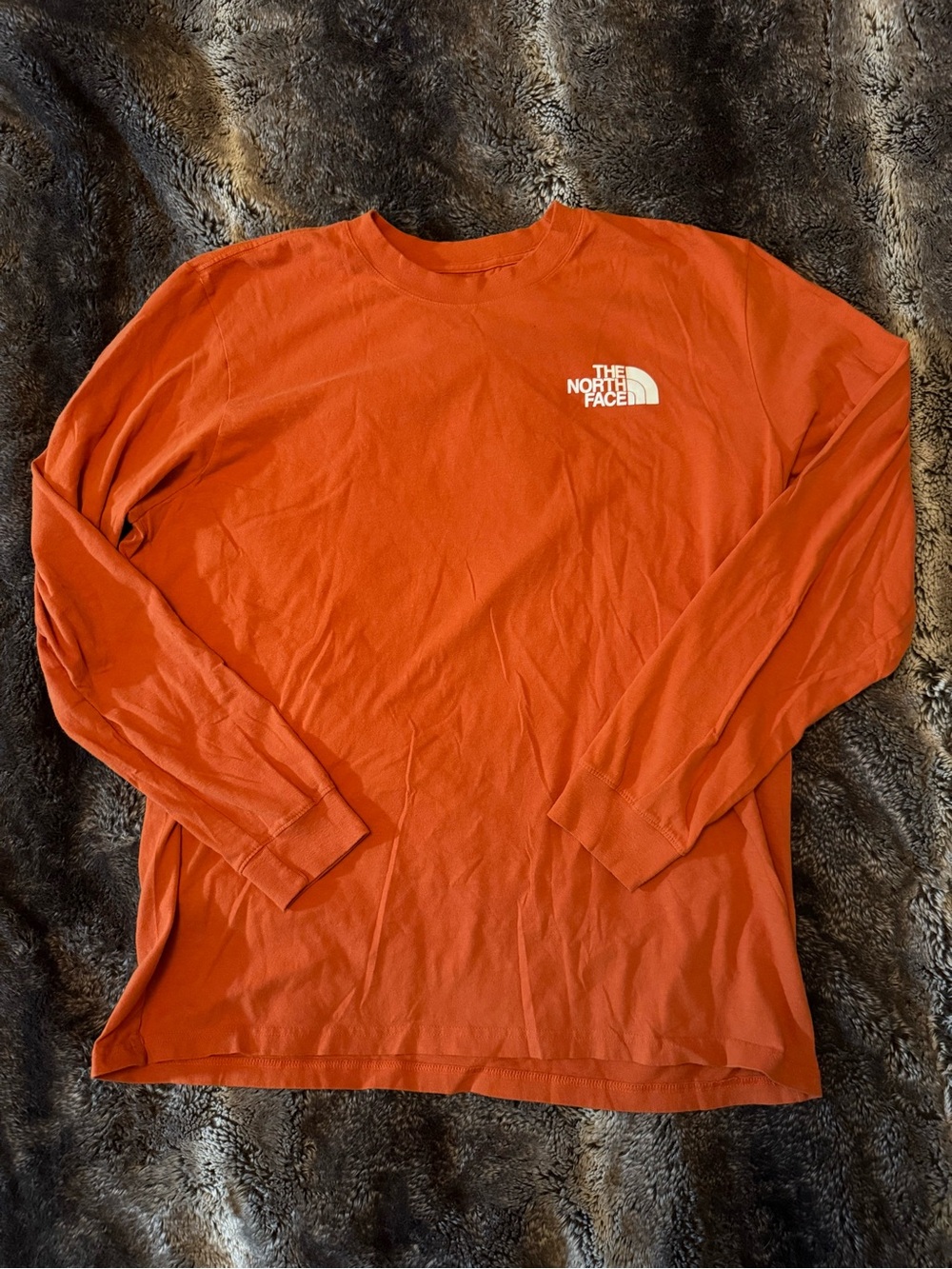 The North Face Men’s Long Sleeve Tee in Orange with White Logo